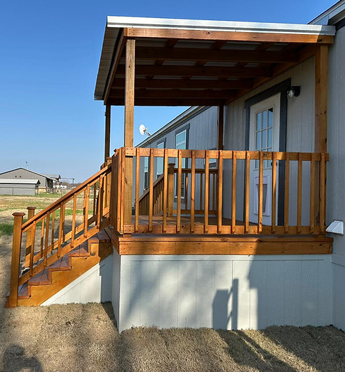 Lavell Decks manufactured home entry deck with covered stairs and landing