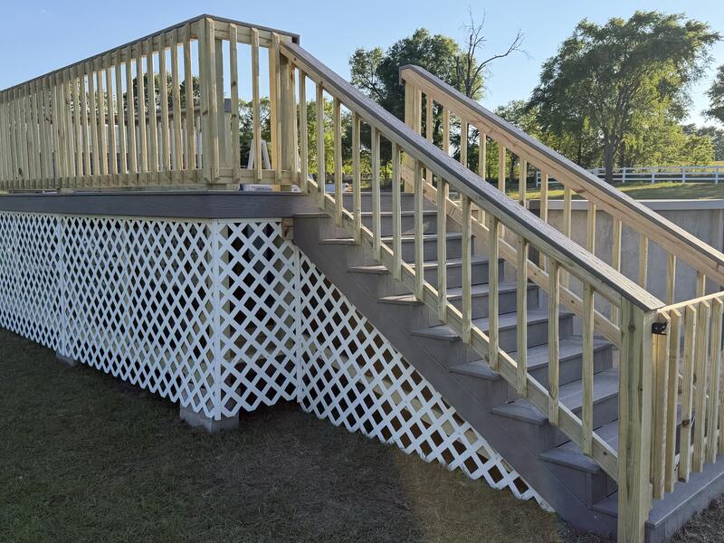 Above-ground pool deck with secure stairs and gate