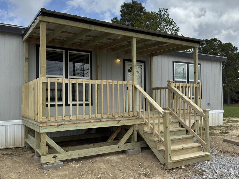 Solid wooden entry deck and steps built by Lavell Decks