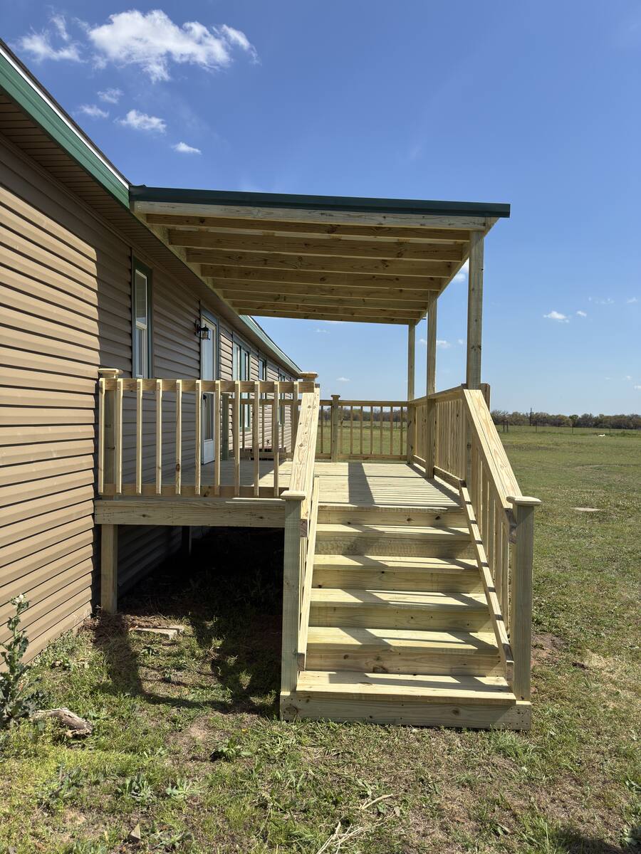 Entry deck on brick home with gable cover