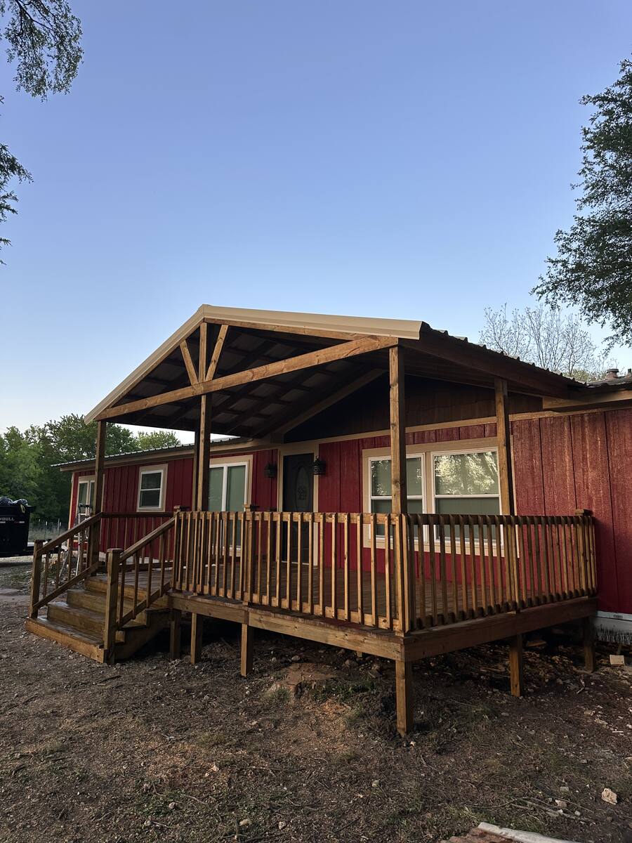 Entry deck on red mobile home