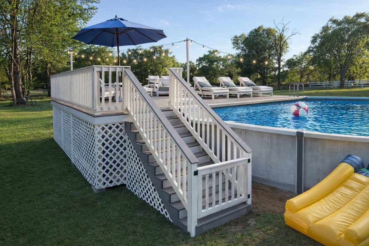 Pool deck with umbrella and loungers