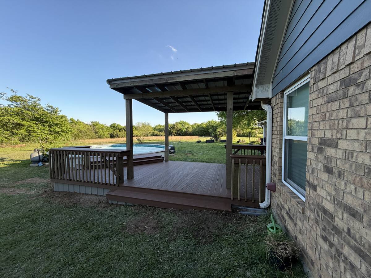 Pool deck with adjacent covered shelter